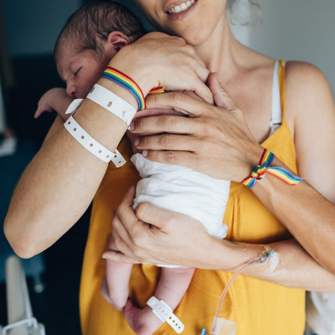 Two lesbian women with a newborn