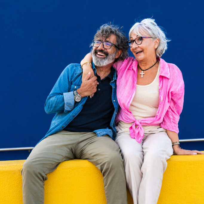 Beautiful happy senior couple bonding outdoors - Cheerful old people romantic dating in the city, concepts about elderly and lifestyle